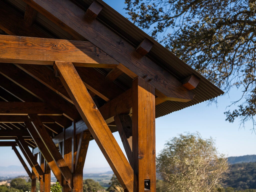 Locally sourced wood used in the outdoor pergola 